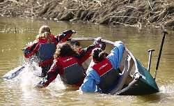 Girls capsize a canoe
